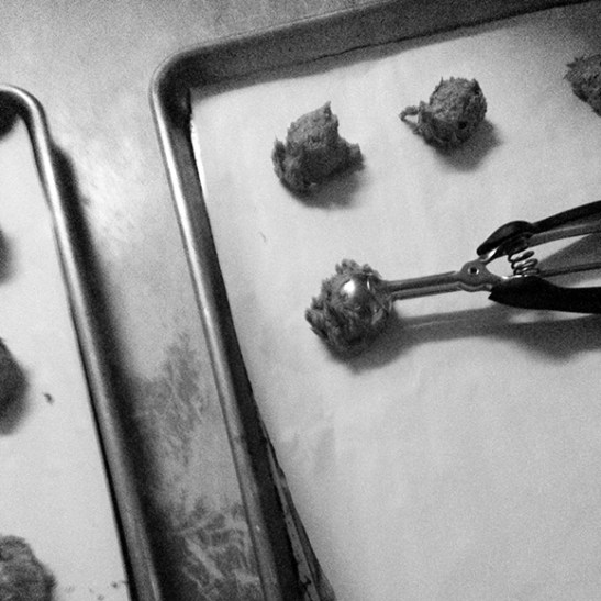 Dropping cookie batter onto baking sheets